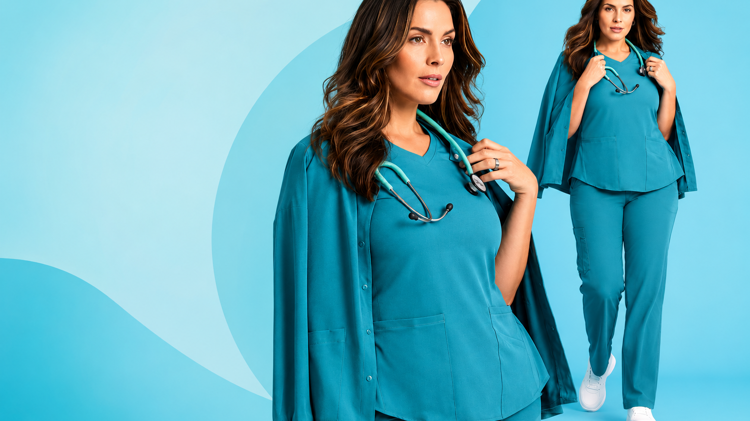 Two plus size models in Caribbean blue scrub tops and trousers fo