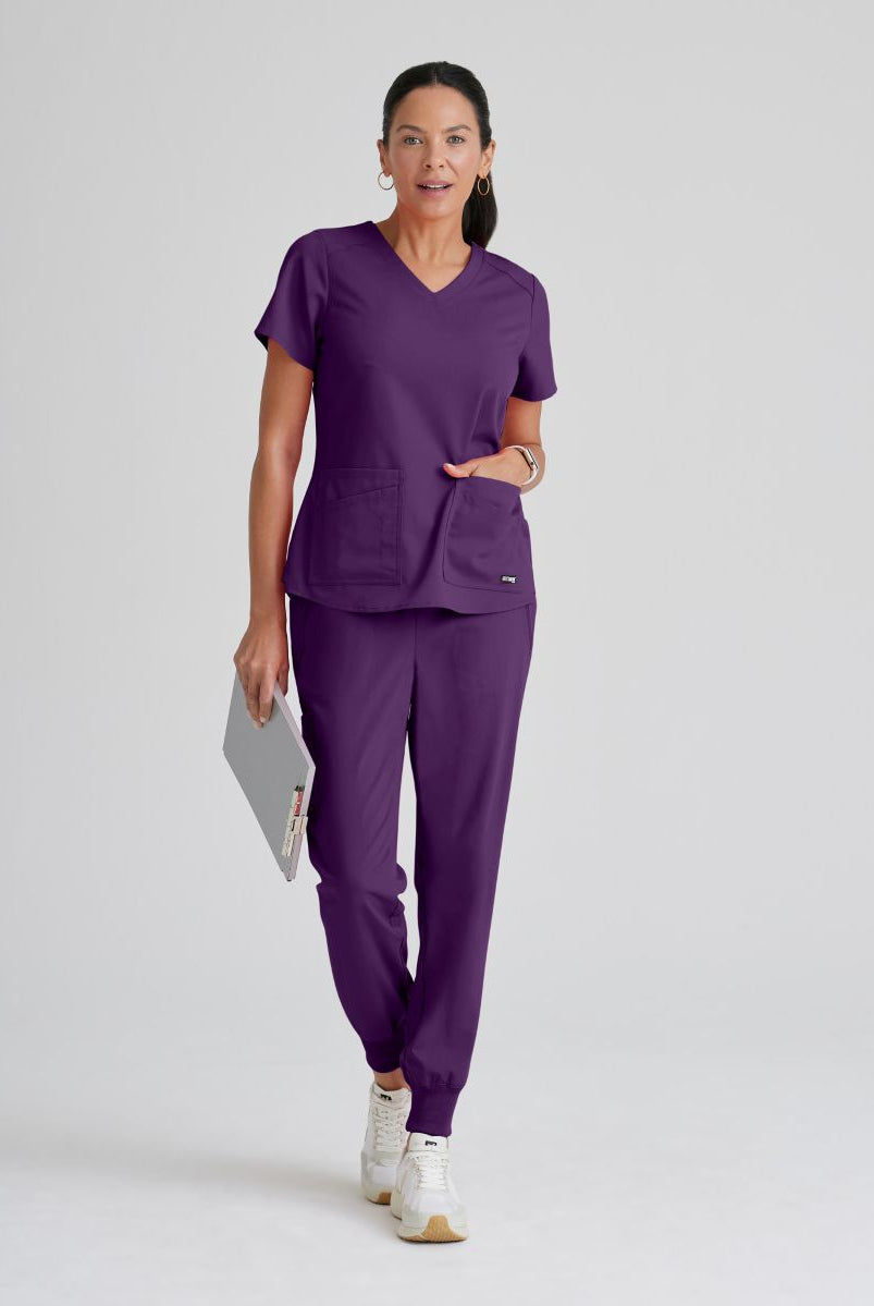 Greys Anatomy Emma 4 pocket, V-neck scrub top with angled seams | Eggplant