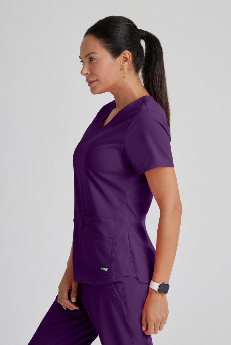 Greys Anatomy Emma 4 pocket, V-neck scrub top with angled seams | Eggplant
