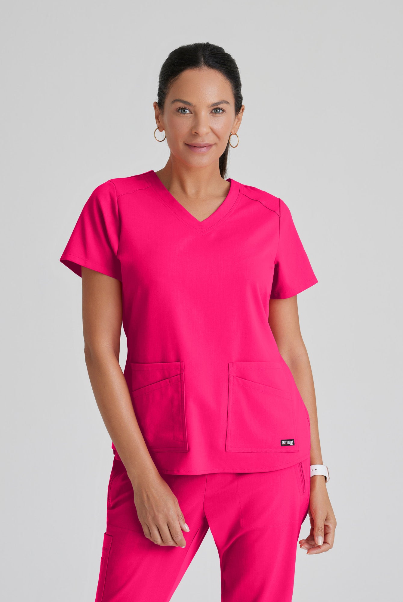 Greys Anatomy Emma 4 pocket, V-neck scrub top with angled seams | VIBRANCE PINK