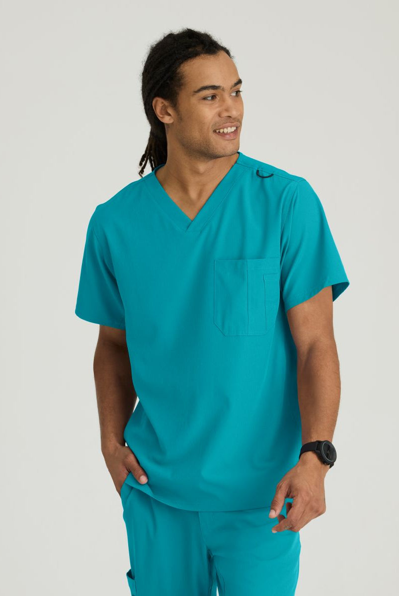 SKECHERS MALE STRUCTURE V-NECK TOP | Teal