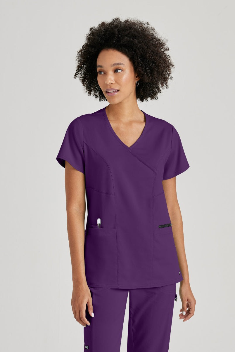 Greys Anatomy V-Neck Kim Top with Zip Front Pocket | Eggplant