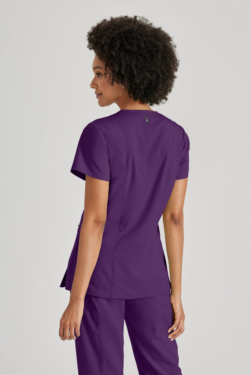 Greys Anatomy V-Neck Kim Top with Zip Front Pocket | Eggplant