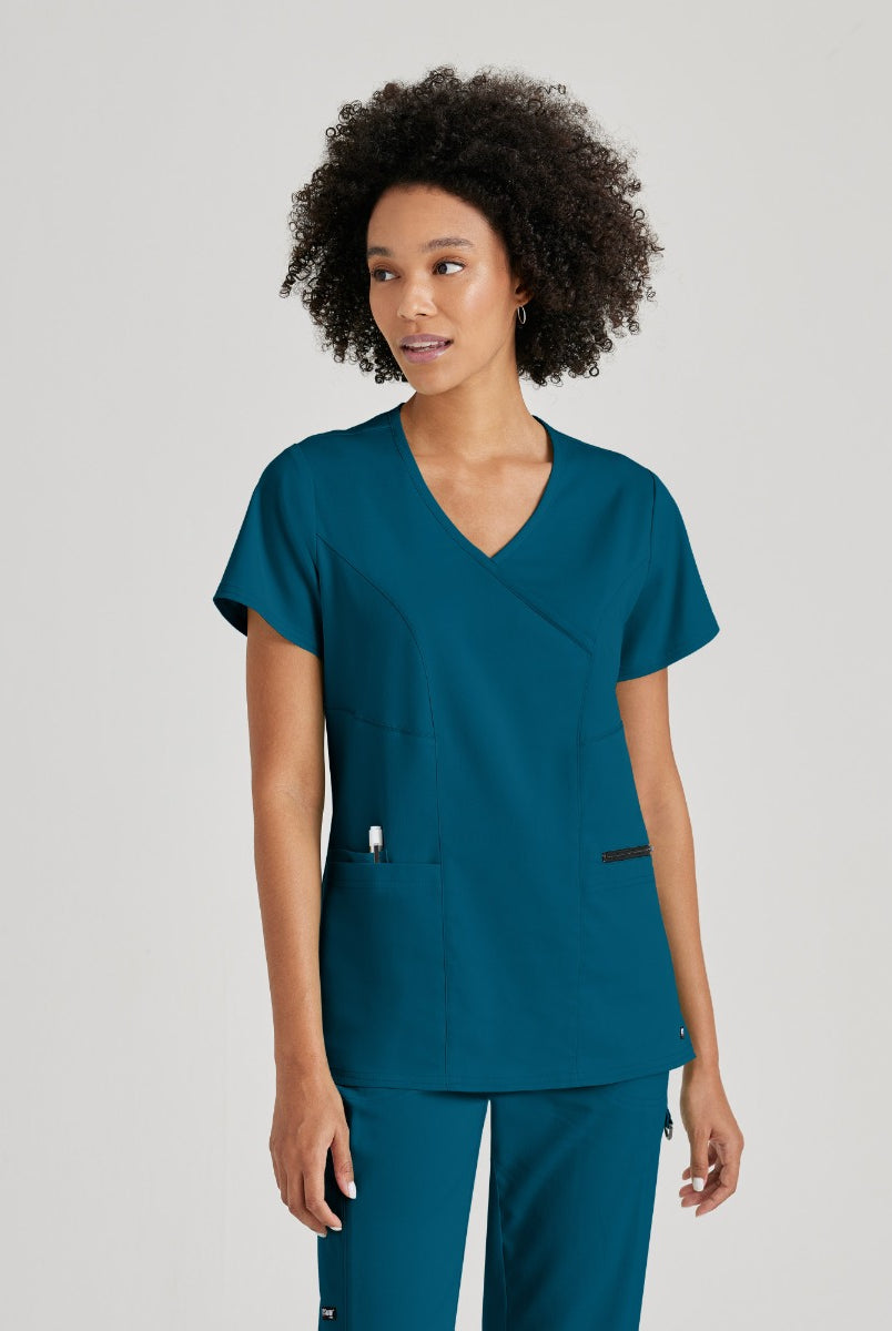 Greys Anatomy V-Neck Kim Top with Zip Front Pocket | Bahama / Caribbean