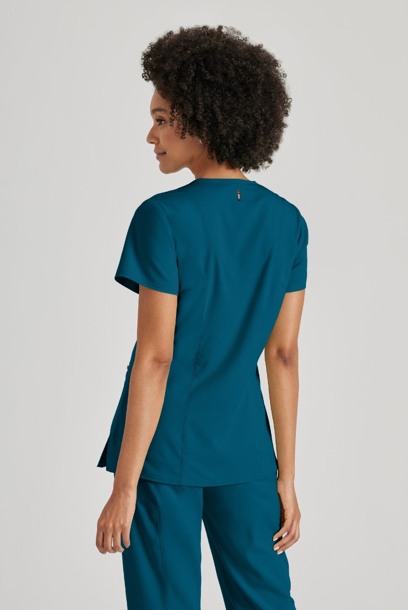 Greys Anatomy V-Neck Kim Top with Zip Front Pocket | Bahama / Caribbean