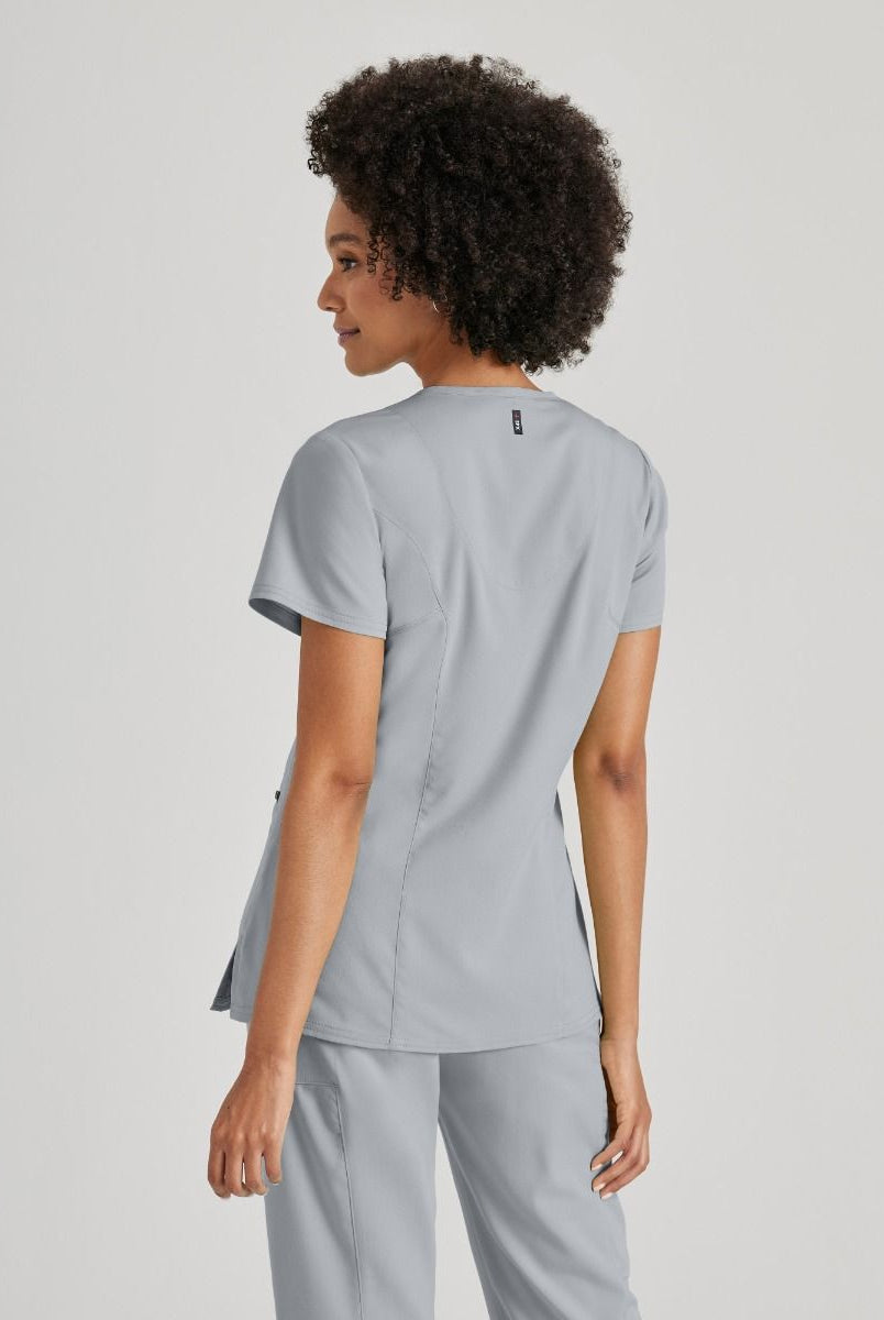 Greys Anatomy V-Neck Kim Top with Zip Front Pocket |  Moonstruck