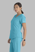 SKECHERS BREEZE 3-POCKET SHAPED HEM TOP | TURQUOISE