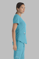 SKECHERS BREEZE 3-POCKET SHAPED HEM TOP | TURQUOISE