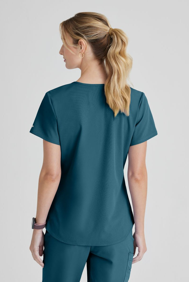 SKECHERS BREEZE 3-POCKET SHAPED HEM TOP | Bahama / Caribbean