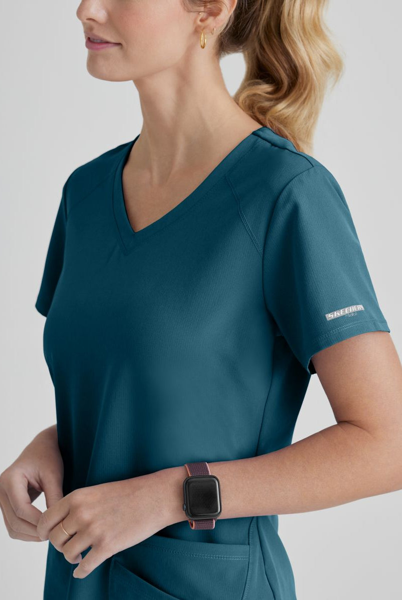 SKECHERS BREEZE 3-POCKET SHAPED HEM TOP | Bahama / Caribbean