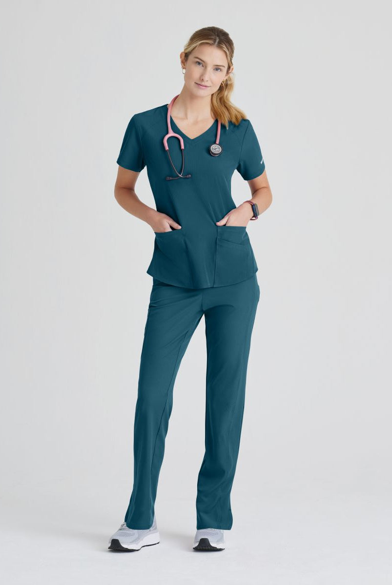 SKECHERS BREEZE 3-POCKET SHAPED HEM TOP | Bahama / Caribbean