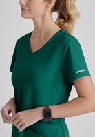 SKECHERS BREEZE 3-POCKET SHAPED HEM TOP | Hunter Green