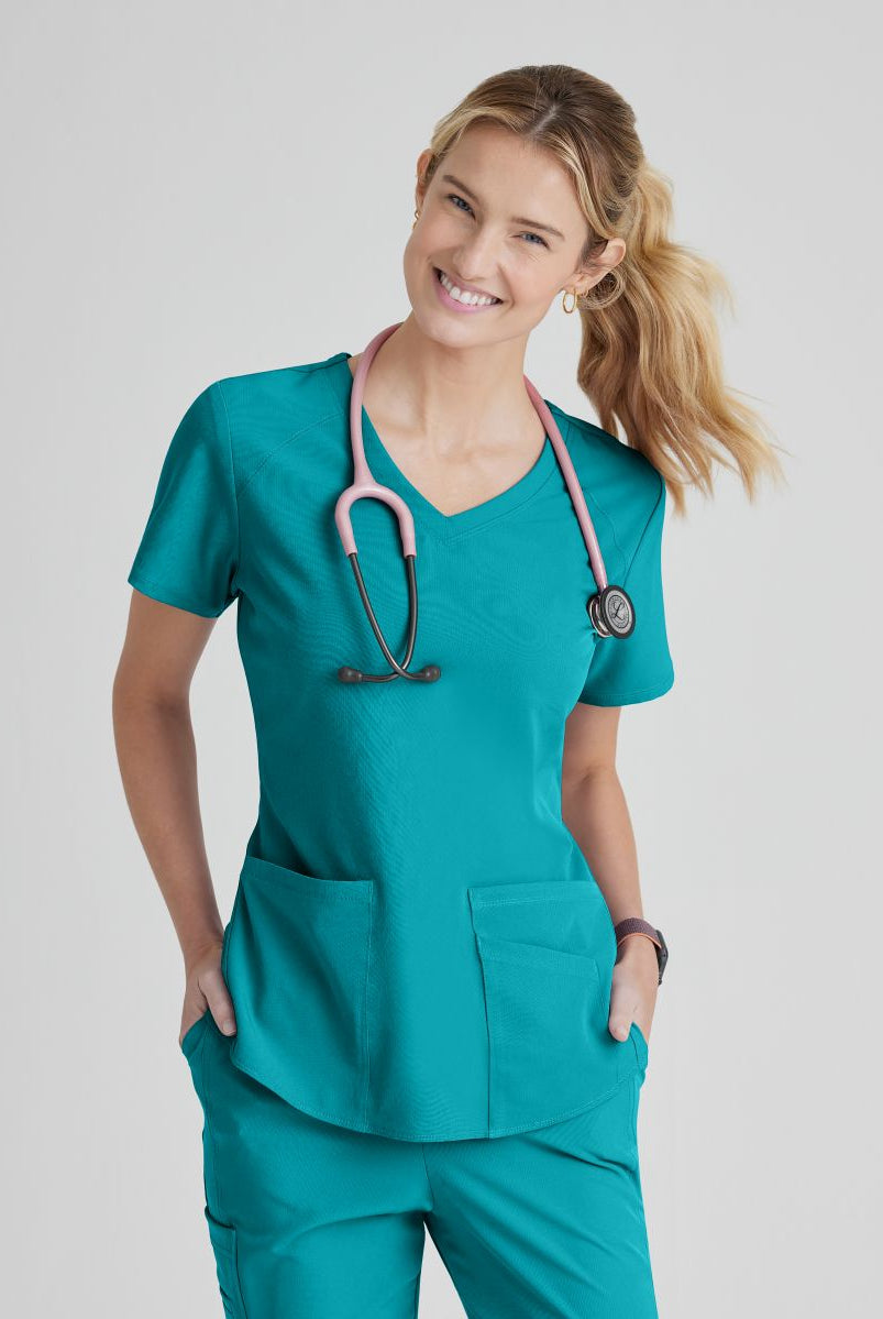 SKECHERS BREEZE 3-POCKET SHAPED HEM TOP | Teal