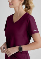 SKECHERS BREEZE 3-POCKET SHAPED HEM TOP | Wine