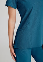 SKECHERS FEMALE RELIANCE 3-POCKET WRAP EFFECT TOP | Bahama / Caribbean