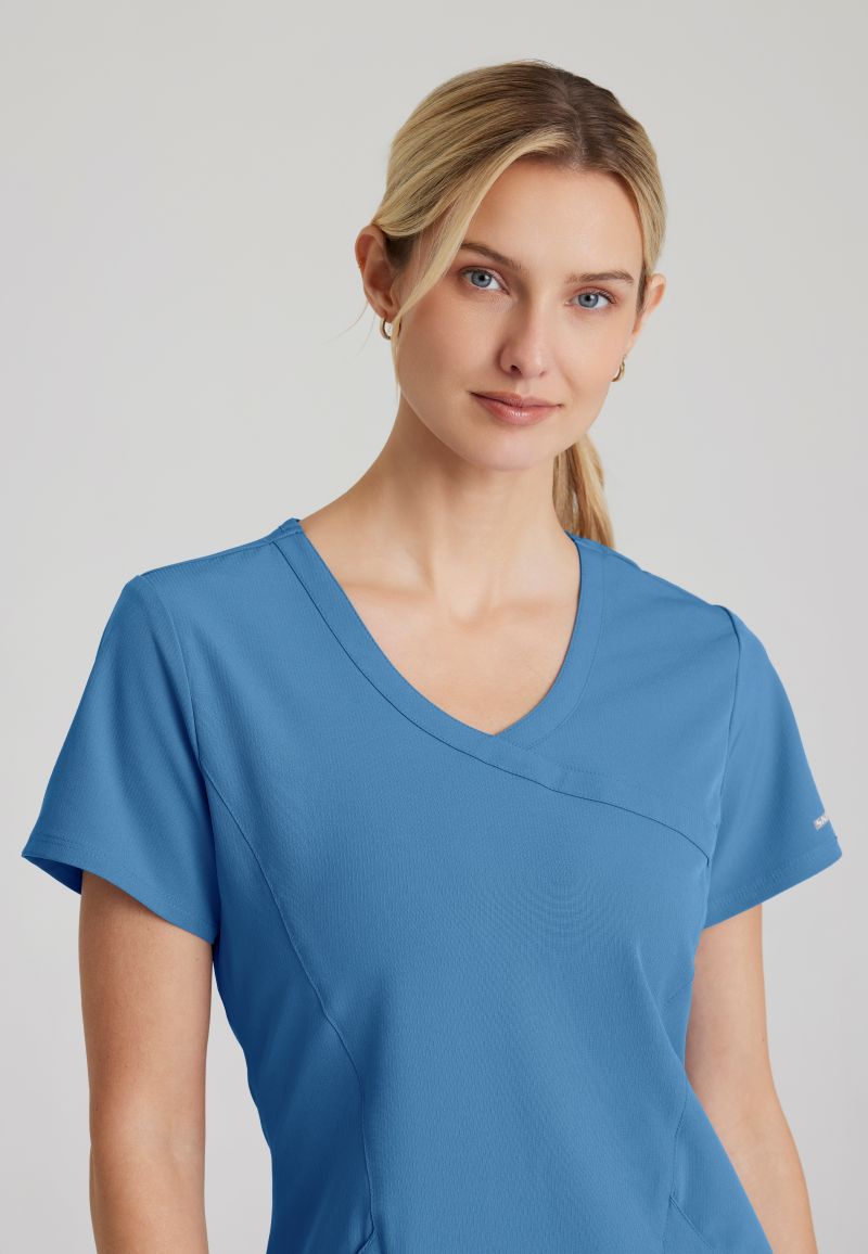 SKECHERS FEMALE RELIANCE 3-POCKET WRAP EFFECT TOP | TRUE CEIL