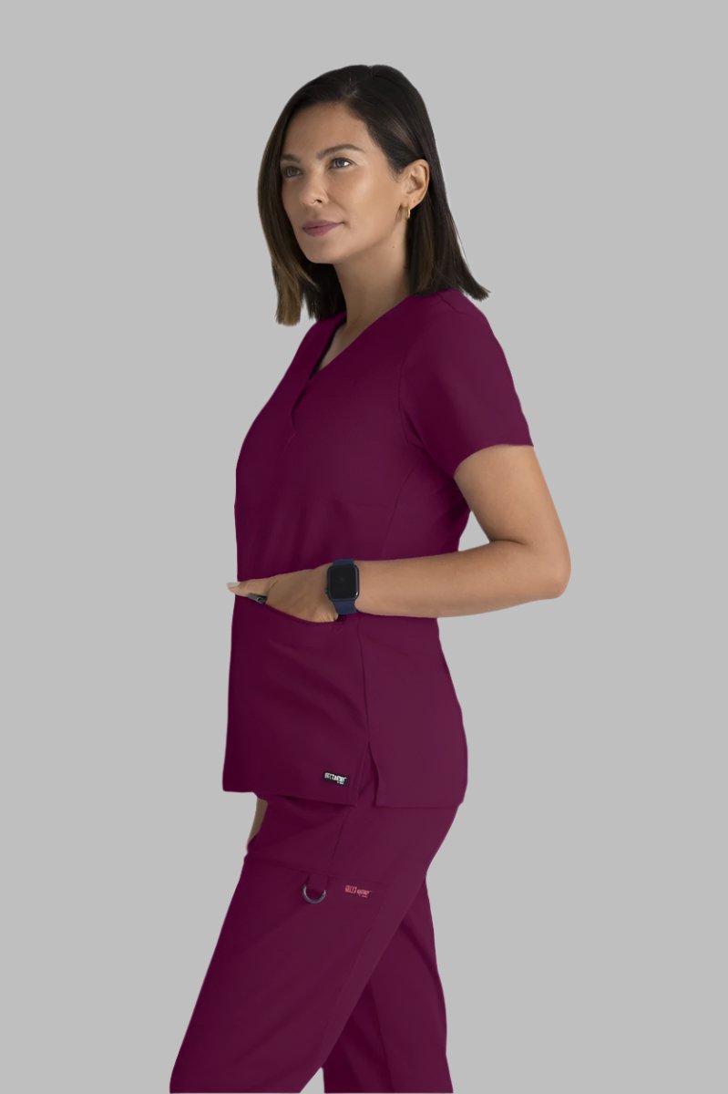 Greys Anatomy V-Neck Kim Top with Zip Front Pocket | Wine