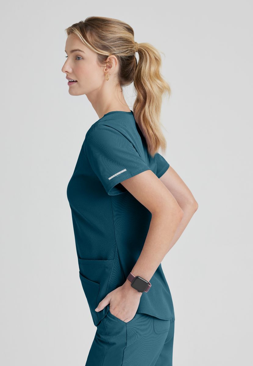 SKECHERS BREEZE 3-POCKET SHAPED HEM TOP | Bahama / Caribbean